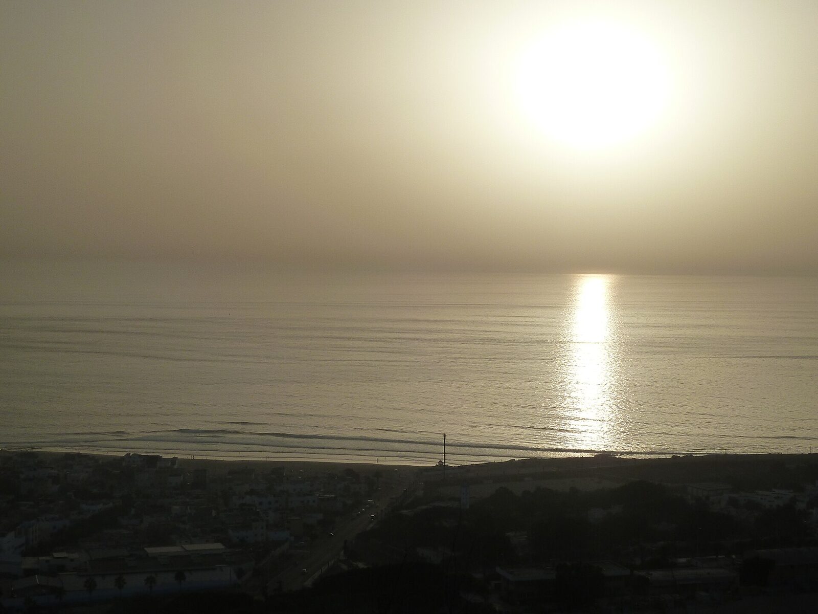 Anza black-sand volcanic beach at sunset, north of Agadir