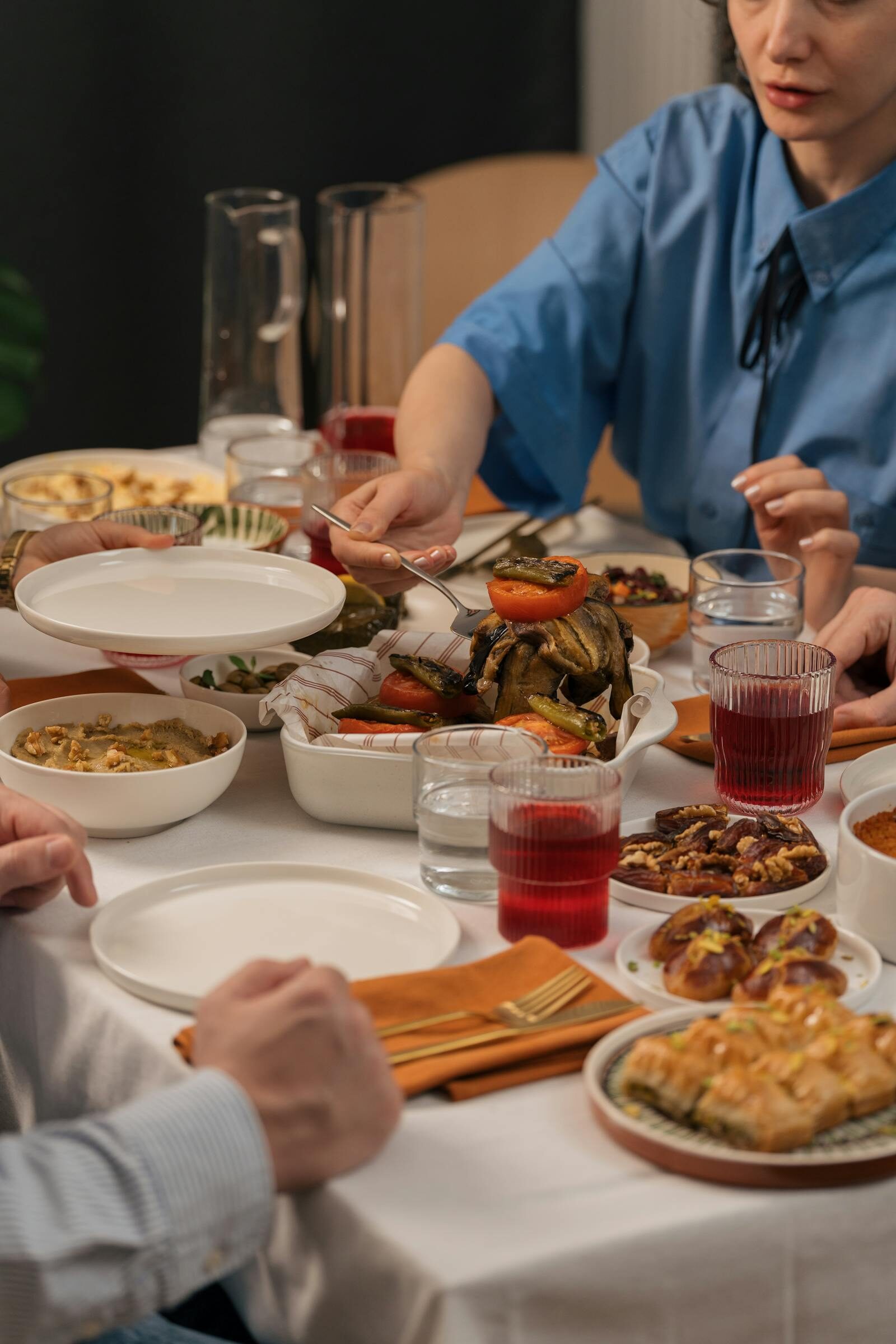 Moroccan diners around a communal table, candid documentary style