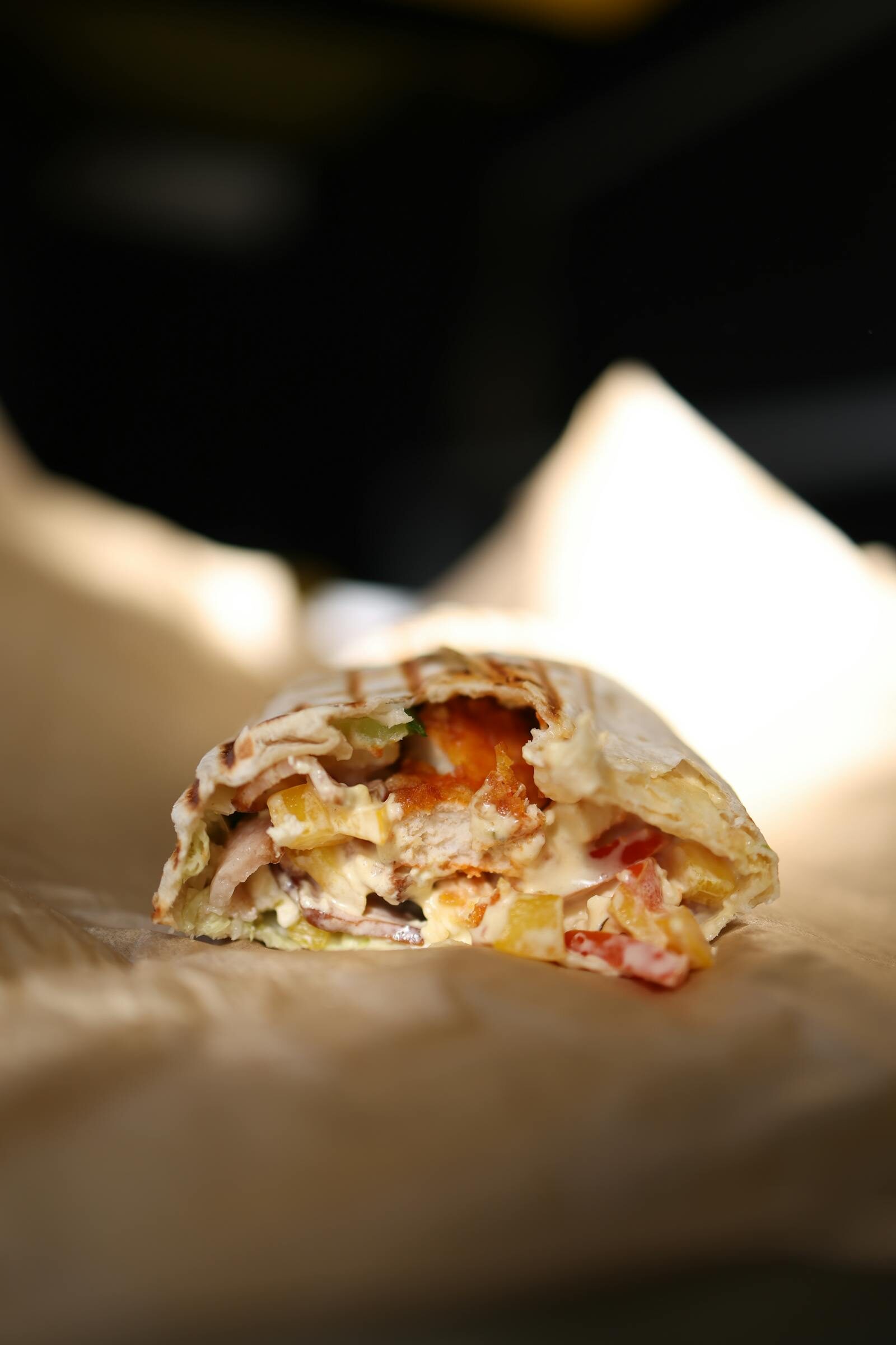 Stuffed Moroccan-style sandwich with meat and vegetables wrapped in flatbread, of the kind served at Mister Cook Hay El Mohammadi Agadir