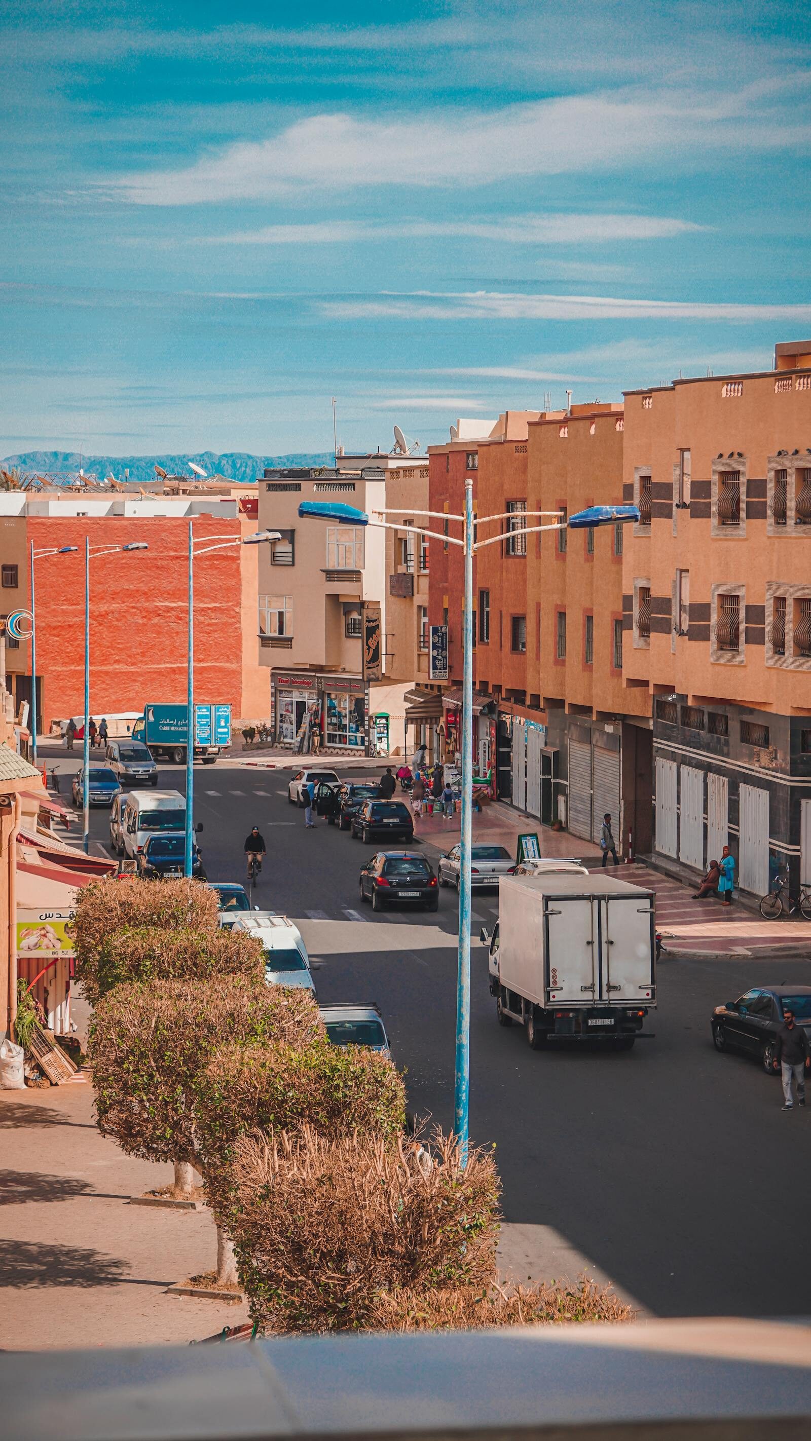 Moroccan urban street in a working neighbourhood like Hay Mohammadi, Agadir — the kind of district Mister Cook anchors